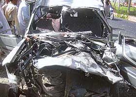 The damaged Qualis which collided with a truck near Kot Karor village on the GT Road in Ferozepore district