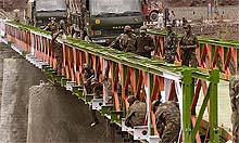 Army personnel give final touches to the Kaman Bridge, near Srinagar, on Tuesday
