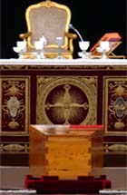 An empty chair is seen behind the altar and Pope John Paul IIs casket during the funeral in St. Peters Square in the Vatican City