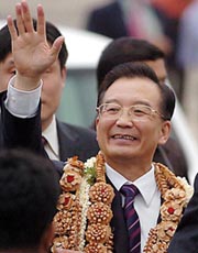 Chinese Premier Wen Jiabao waves during his arrival at Bangalore airport on Saturday.