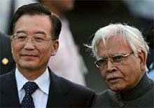 External Affairs Minister Natwar Singh poses with Chinese Prime Minister Wen Jiabao at New Delhis Palam Airport on Sunday. 