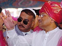 Pakistan President Pervez Musharraf responds to the waiting media after paying obeisance at Khwaja Moinuddin Chisti Dargah at Ajmer Sharif on Saturday.