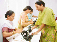 Ms Huma Parveen, a Pakistani national, trains Indian inmates in cutting and tailoring in Central Jail, Amritsar, on Saturday.