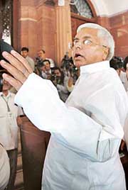 Union Railway Minister Laloo Prasad Yadav arrives at Parliament House in Delhi on Monday. 