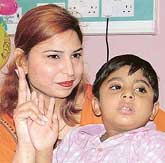 Four-year-old Pakistani boy Safi Khan with his mother Anila Khan after undergoing bloodless liver transplant at Sri Ganga Ram Hospital in New Delhi on Thursday.