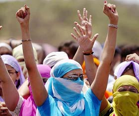 Bar girls raise slogans against the decision to close down 600 dance bars in  Mumbai on Tuesday.
