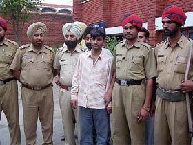 Mintu Kumar, a “tantrik”, in police custody in connection with a double murder case in Pathankot