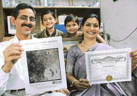 Ramesh Sharma and Madhu Sharma show documents related to their ownership of property at moon.