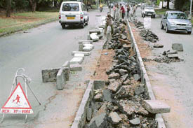 The under-construction divider on the road separating Sectors 8 and 9 poses a threat to motorists during night time as debris and concrete slabs are left on the road.