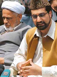 All-Party Hurriyat Conference Chairman Mirwaiz Omar Farooq, with another Hurriyat executive member, addresses a Press conference in Srinagar
