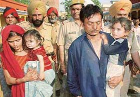 Ram Kumar, servant of Ponty Chadha, along with his wife, Geeta, who was arrested by the Jalandhar police in Amritsar