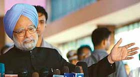 Prime Minister Manmohan Singh talks to the media on his arrival from Russia at Air Force station, Palam, in New Delhi