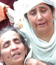 Relatives wail on the death of Mohammad Syed, his son and daughter when a parcel bomb exploded in Beijbhara on Friday.
