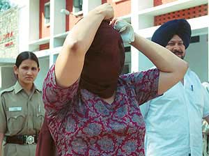 Irma Bajwa, accused in a cheating case, being produced in court in Chandigarh