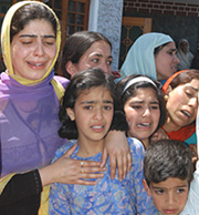 Wailing relatives of Abdul Gani Bhat, brother of former top Hizbul Mujhideen commander Zaffar Abdul Fateh, who was shot dead by militants at Bagh-e-Mehtab on the outskirts of Srinagar on Saturday morning.