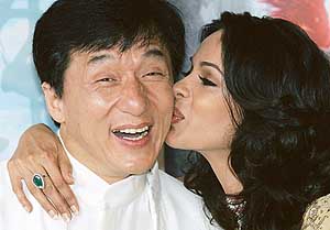 Bollywood actress Mallika Sherawat (right) kisses Hong Kong actor Jackie Chan at a photocall for Hong Kong director Stanley Tongs film The Myth during the 58th Cannes Film Festival on Tuesday.