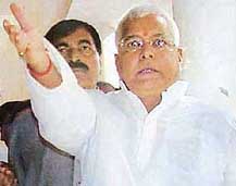 Railway Minister Lalu Prasad arrives to appear before a special CBI court in the fodder scam case, in Ranchi on Tuesday. 