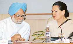 Chairperson of the United Progressive Alliance (UPA) Sonia Gandhi talks with Prime Minister Manmohan Singh during a UPA-Left Coordination Committee meeting in New Delhi on Wednesday. 
