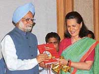 UPA Chairperson Sonia Gandhi releases a report titled A Caring Government in New Delhi on Sunday along with Prime Minister Manmohan Singh. The report was released on the completion of one year of the UPA government.