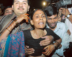 A wailing relative of an injured person outside the Liberty cinema after a bomb blast in New Delhi on Sunday. 