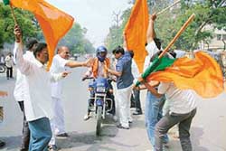 BJP activists try to stop a motorcyclist during the Bihar bandh in Patna on Tuesday. 