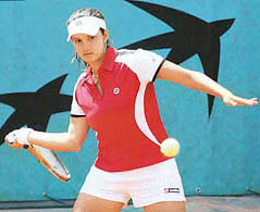 Sania Mirza returns the ball to Kristina Brandi of Puerto Rico and Nana Miyagi of Japan during their women’s doubles match in the first round of the French Open at Roland Garros on Wednesday. Sania and team-mate Anna Chakvetadze of Russia won 6-2, 6-3.