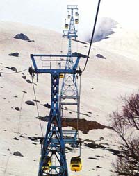 Cable cars move between the towers after the launch of the second phase of Kashmirs cable car in Aphanwat