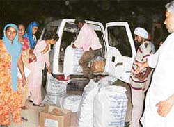 Rotten eatables being loaded in a government vehicle in the presence of anganwadi supervisors