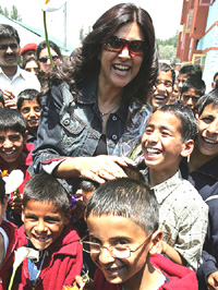 Actress and former Miss Universe Sushmita Sen, poses with a group of orphans at Muskaan, an orphanage run by the Army for militancy affected children, in Srinagar on Sunday.