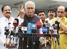 BJP President and Opposition Leader in the Lok Sabha L K Advani talks to the media on his arrival from Pakistan at IGI Airport in New Delhi on Monday. 