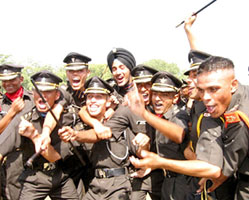 Newly commissioned Army officers celebrate after the passing-out parade at the IMA in Dehra Dun on Saturday.