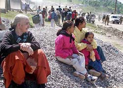 A family waits for permission at the Baltal base camp on Tuesday to proceed towards the holy cave shrine of Amarnath.
