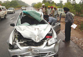 The mangled remains of a car that rammed into a stationary truck on the GT Road at Pilkhani village, near Rajpura The accident claims the life of a 13-year-old girl on Sunday morning.