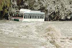 A Delhi-bound bus of the HRTC coming from Manali is stranded on NH-21 caught in the swirling waters of the Beas. This picture was taken by Tribune photographer Pankaj Sharma on Wednesday afternoon.