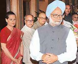 Prime Minister Manmohan Singh talks with members of the media as Congress President, Sonia Gandhi, and Cabinet Minister looks on, at 7 R.C.R before his departure to Washington in New Delhi
