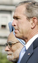 U.S. President George W. Bush (R) and Prime Minister Manmohan Singh stand at attention during the playing of the Indian national anthem at the White House, on Monday.