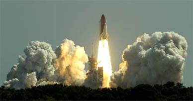 The space shuttle Discovery lifts off from pad 39B at the Kennedy Space Center in Cape Canaveral, Florida