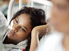 A woman suffering from a water-borne disease lies in a hospital in Mumbai on Friday