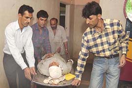 Men rush a wounded civilian for medical treatment in a hospital in Srinagar on Wednesday. A CRPF jawan was killed and nine others were injured when militants blew up a car filled with explosives