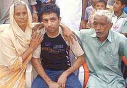 Ram Pal with his parents at his native village Taragarh, about 15 km from Hoshiarpur, on Friday.
