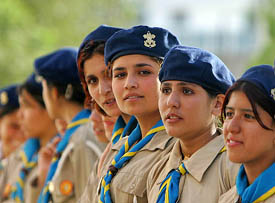 Afghan scouts wait for the arrival of Afghanistan’s President Hamid Karzai and Prime Minister Manmohan Singh before the inauguration of Habibia High School in Kabul on Sunday