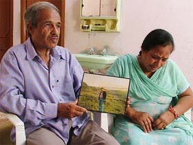 Mr Satpal and Ms Santosh, parents of Bharat Bhushan, who has been imprisoned in Pakistan, with his photograph in Ludhiana