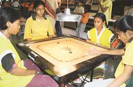 Players think to make the next move during the 33rd sub-junior national and inter-state carrom meet being held at Sector 10 Skating Rink in Chandigarh on Friday.