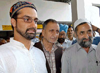Hurriyat leaders Mirwaiz Omar Farooq, Prof Abdul Ghani Bhatt and Fazal Qureshi come out of airport in New Delhi on Sunday evening.