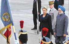 Prime Minister Manmohan Singh inspects the guard of honour on his arrival at Orly airport in Paris on Sunday