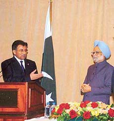 Pakistan President Pervez Musharraf points at Prime Minister Manmohan Singh after their joint Press conference in New York