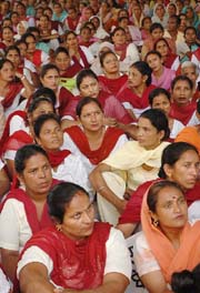 Members of the Anganwari Workers and Helpers Coordination Committee, Punjab, stage a dharna at Desh Bhagat Yadgar Hall in Jalandhar on Tuesday.