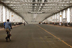 Howrah Bridge, called the gateway to Kolkata, generally crowded with vehicles and people, wears a deserted look on Thursday due to the nationwide strike called by trade unions. 