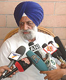 Former Akali minister Nirmaljit Singh Kahlon talks to media after a CBI raid at his residence in Amritsar on Friday.