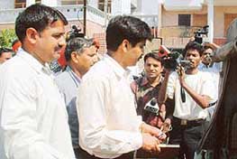 Members of a CBI team outside the residence of former Akali Minister Nirmaljit Singh Kahlon in Amritsar on Friday.